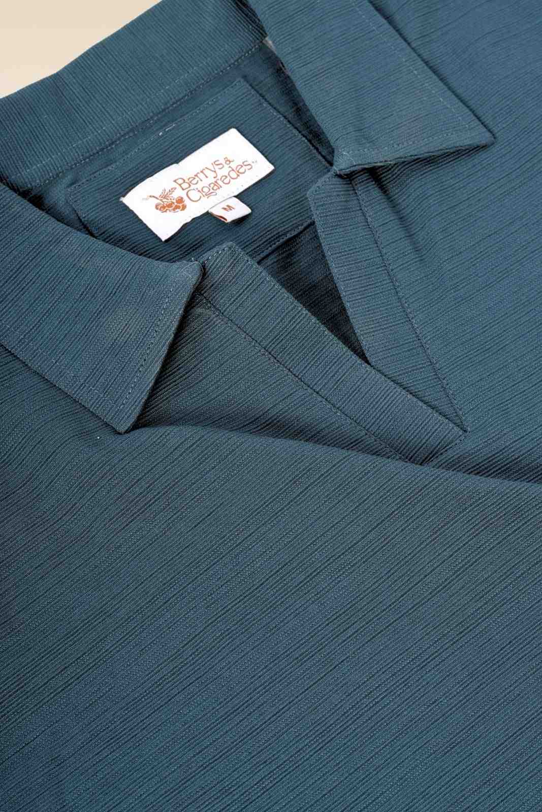 Berrys & Cigaredes brand label | Premium fabric detail | Dark teal textured cotton