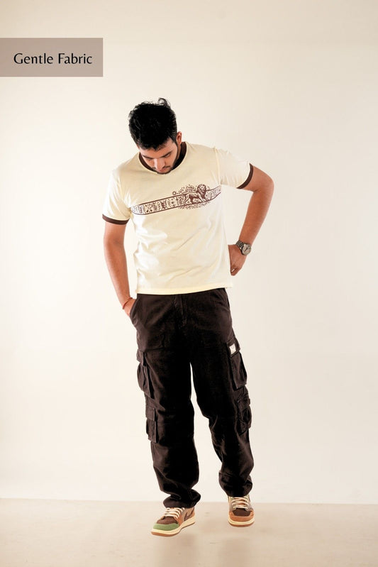 Premium men's graphic t-shirt from Berrys & Cigaredes - cream base with detailed brown heritage print, regular fit, showcasing artistic streetwear design and gentle fabric quality