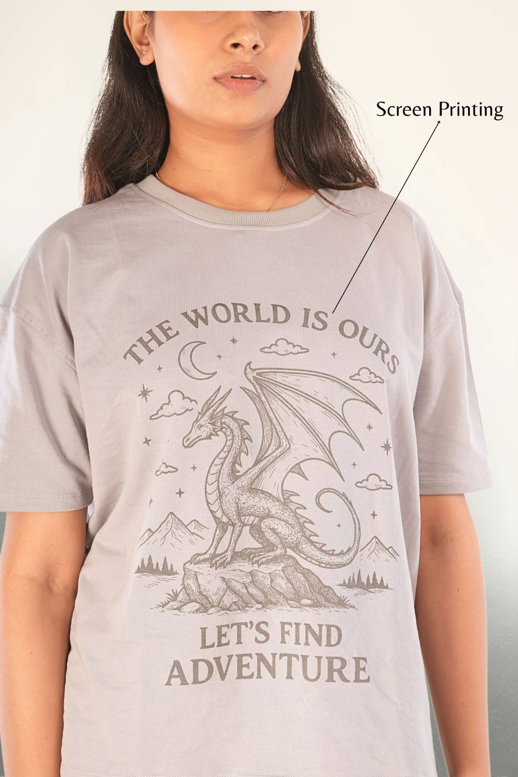  Close-up of premium screen-printed dragon artwork with adventure text typography on grey graphic t-shirt