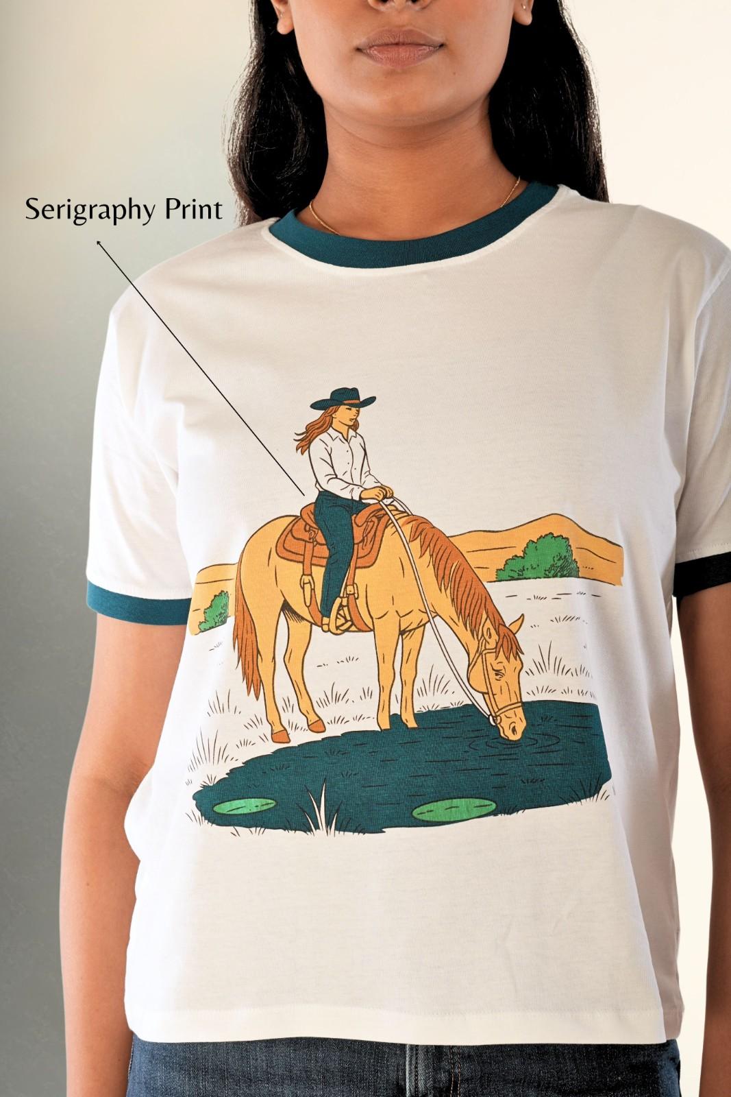Serigraphy cowgirl horse graphic detail on women’s white tee, premium Indian streetwear by Berrys & Cigaredes.
