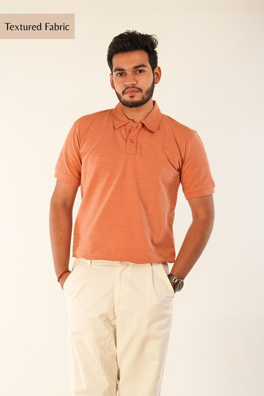 Premium orange piqué polo shirt designed by Berrys & Cigaredes. Textured cotton construction, polo collar, button placket. Men's casual-smart menswear with confidence and comfort.