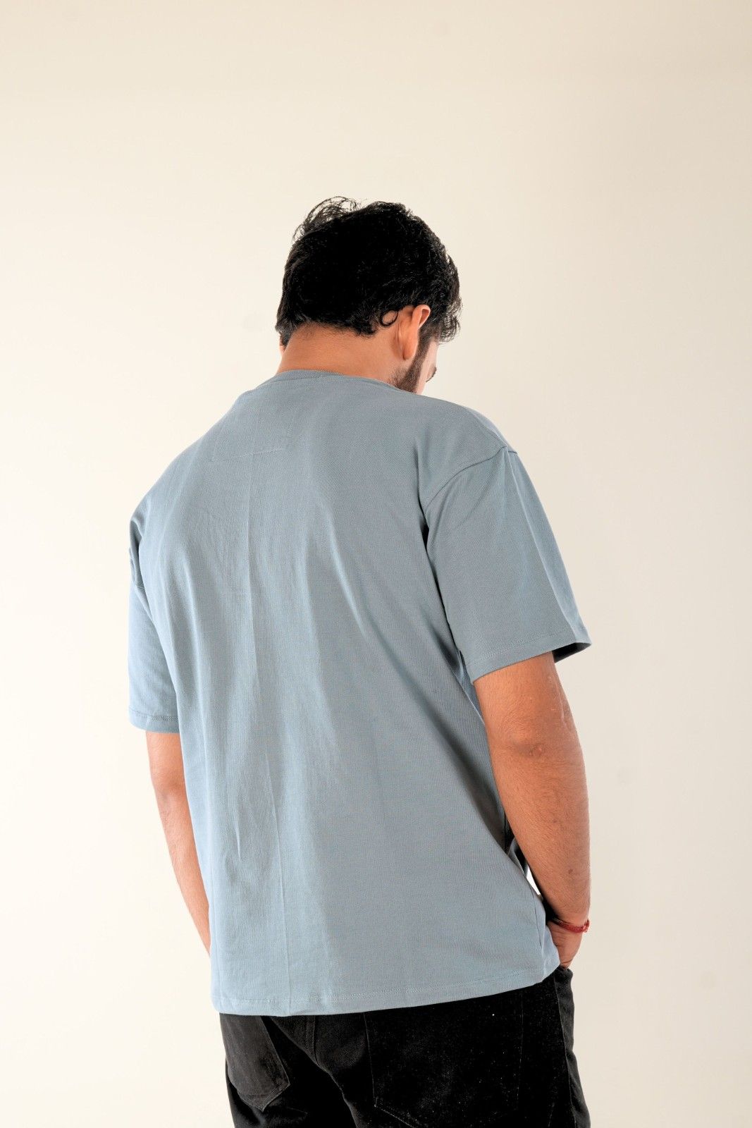 Back view of ice blue premium cotton oversized t-shirt with clean, minimal design - premium menswear by Berrys & Cigaredes