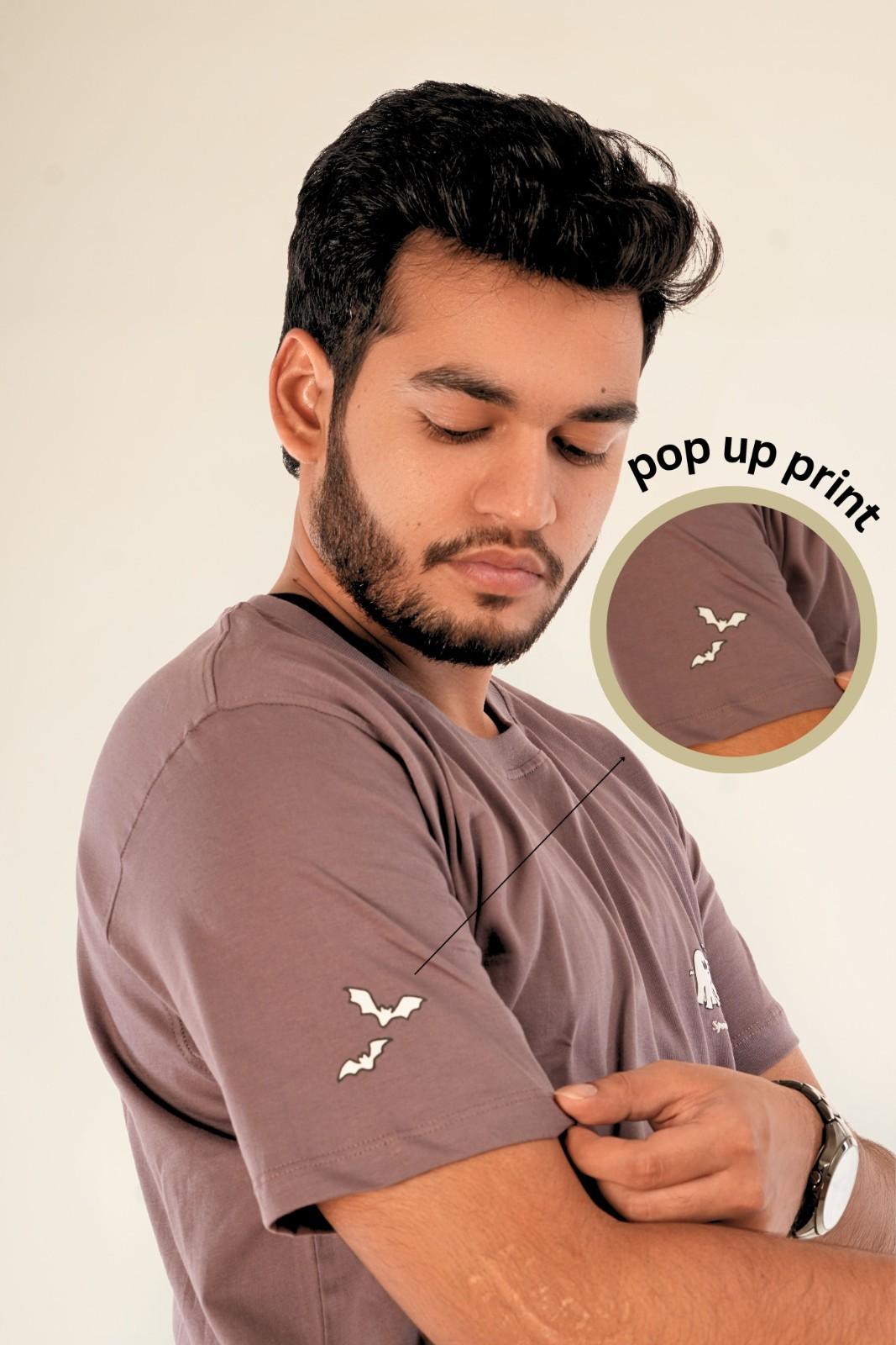 Side view muted mauve t-shirt with pop up bat puff print on sleeve, ghost chest graphic, premium regular fit, playful streetwear details