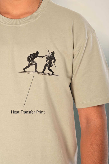 Close-up of heat transfer print detail showing minimalist two-figure warrior fighting illustration with refined line-art aesthetic. Demonstrates premium print quality, color precision, and craftsmanship on sage grey heavyweight cotton. Berrys & Cigaredes design detail.

Minimalist warrior heat transfer print detail on sage grey premium cotton chest