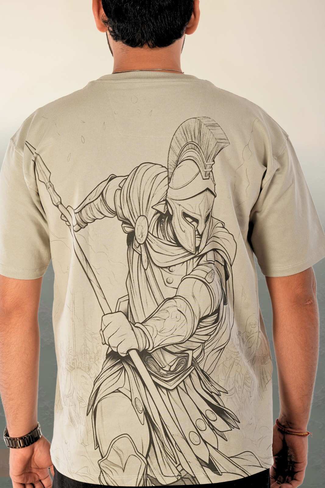 Men's premium oversized graphic t-shirt in sage grey with large-scale detailed warrior and gladiator illustration featured on full back. Intricate monochrome line-art design on gentle heavy-weight cotton with relaxed drop-shoulder oversized fit. Berrys & Cigaredes artistic statement piece.

Oversized t-shirt with large-scale detailed warrior illustration on back, sage grey