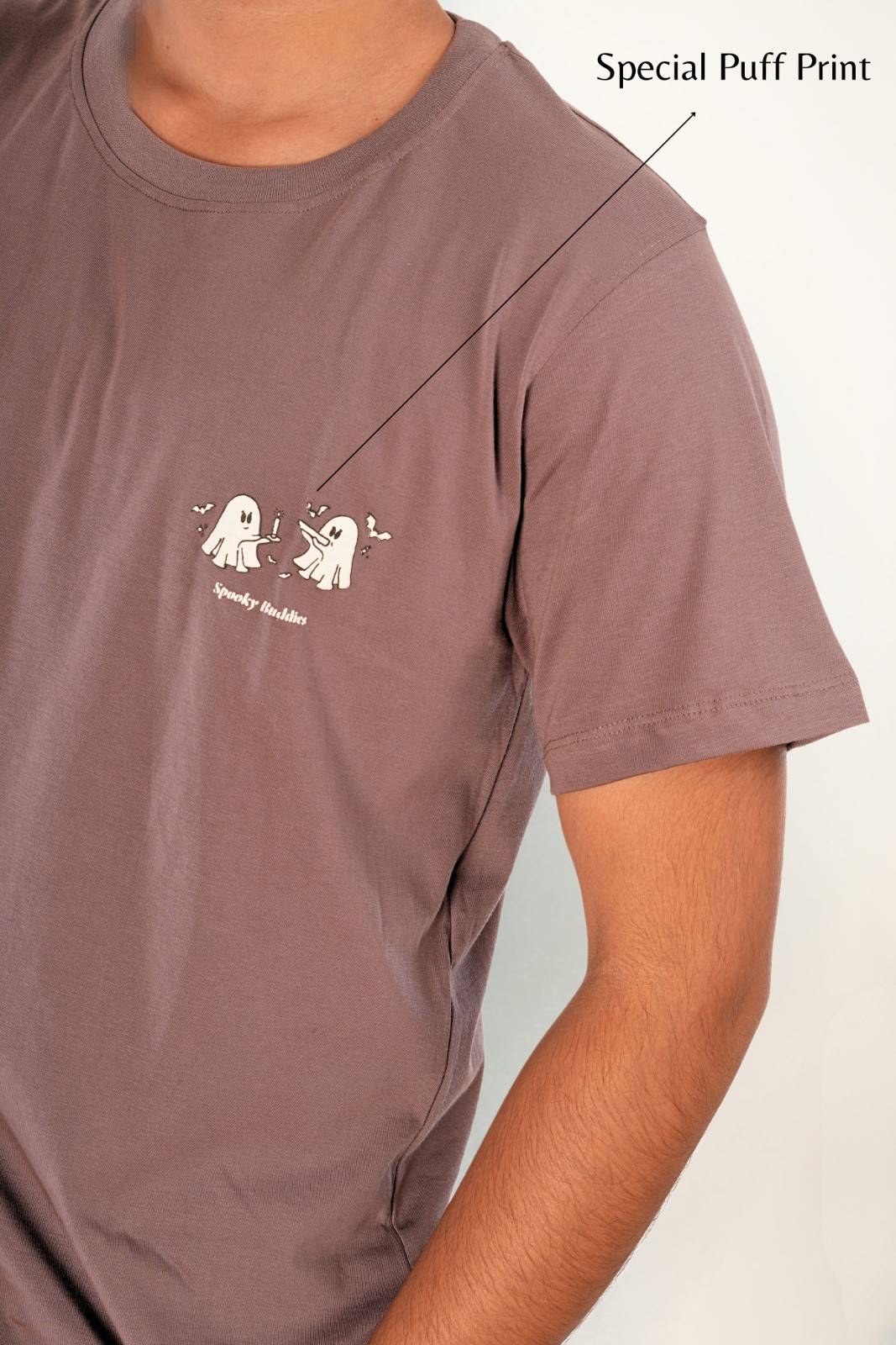 Close-up of 3D puff print ghost graphic on muted mauve t-shirt, raised texture print, spooky buddies design, premium printing technique